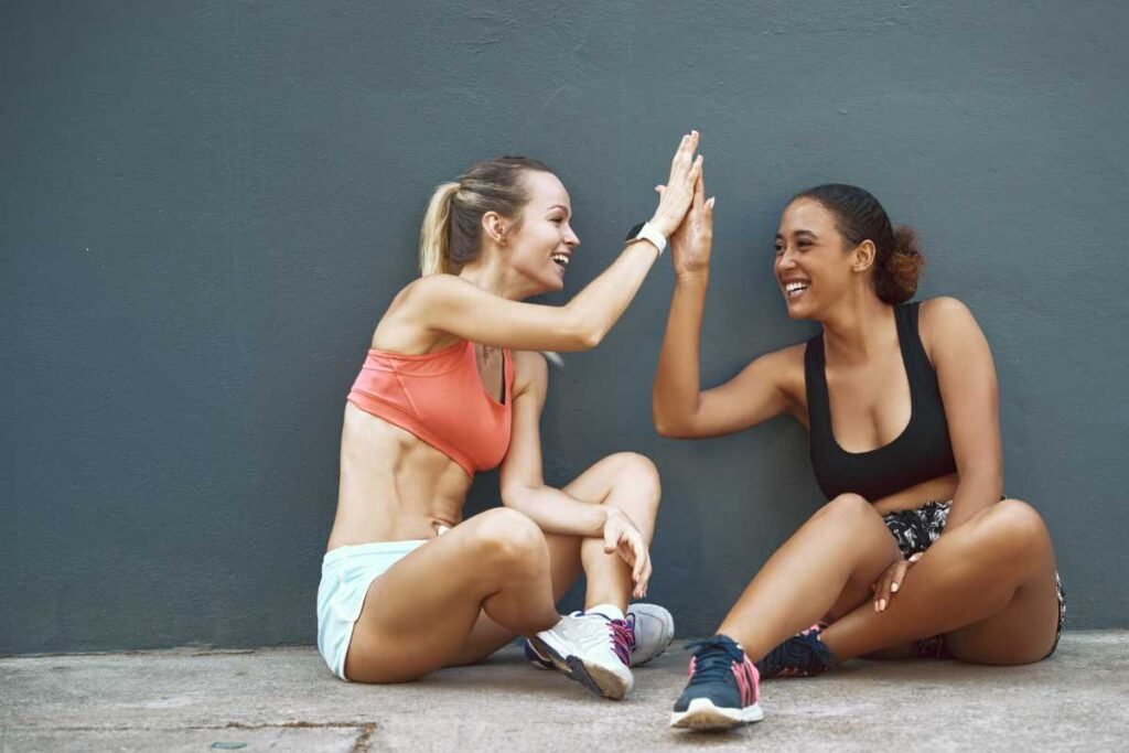 Navigating the Green Eyed Monster Handling Jealousy in Friendships Two Women High Five