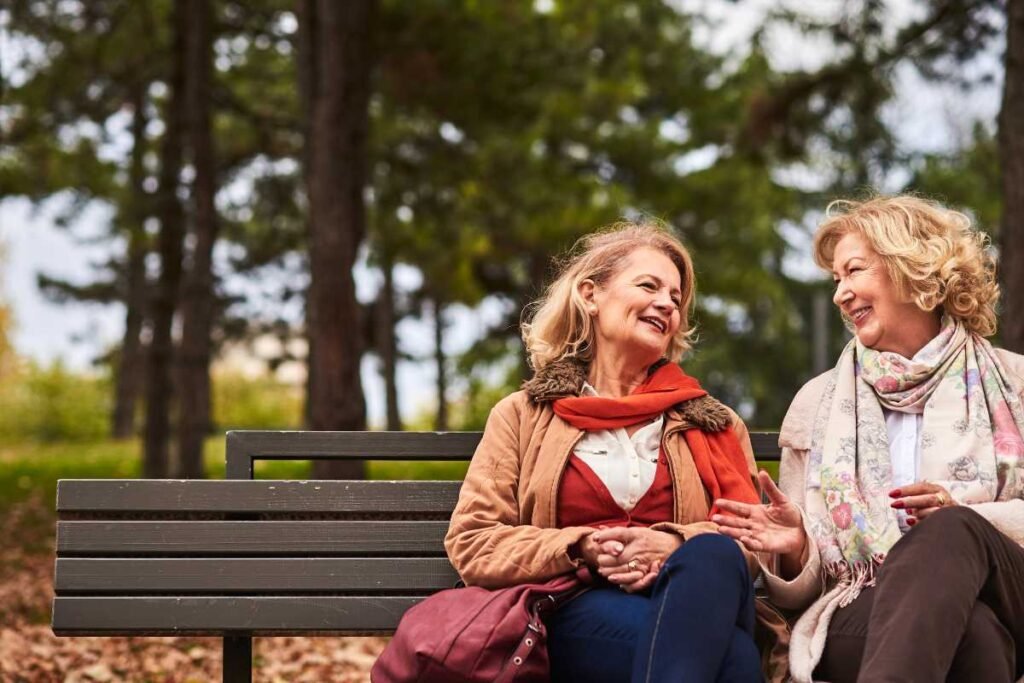 Navigating the Green Eyed Monster Handling Jealousy in Friendships Two Women on a Bench