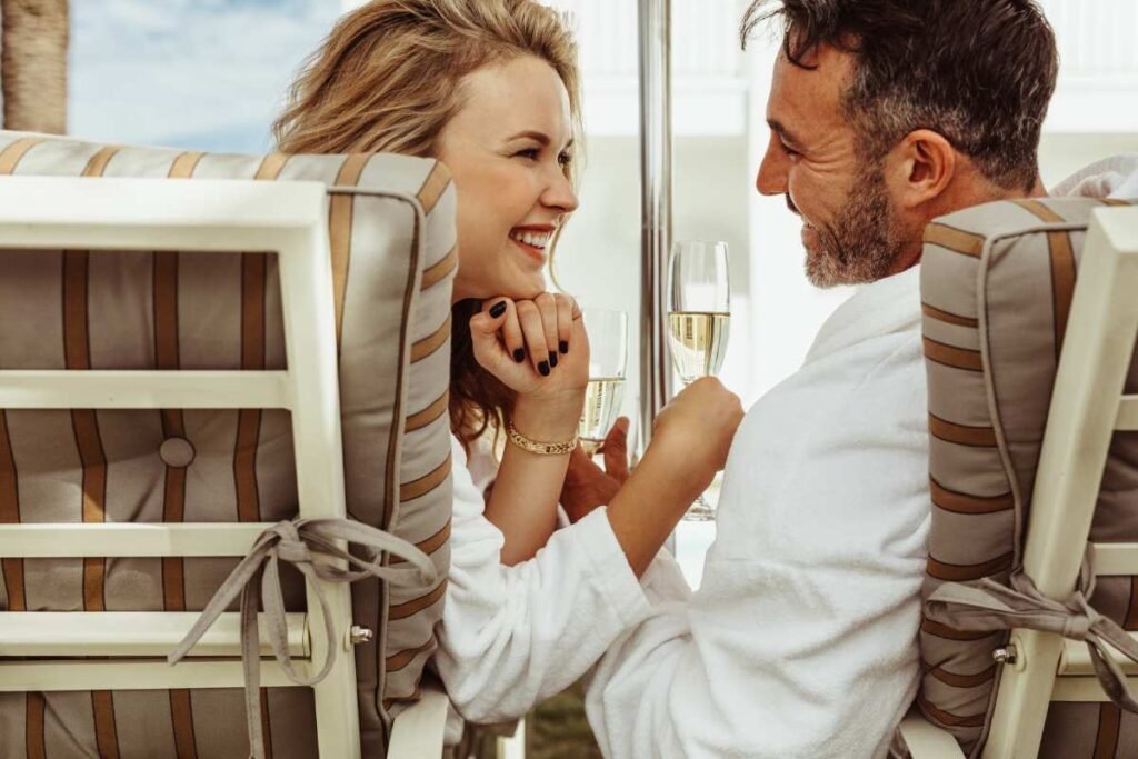 How to Tell if He’s Into You: The Subtle (and Not-So-Subtle) Signs 5 man and woman drinking champagne